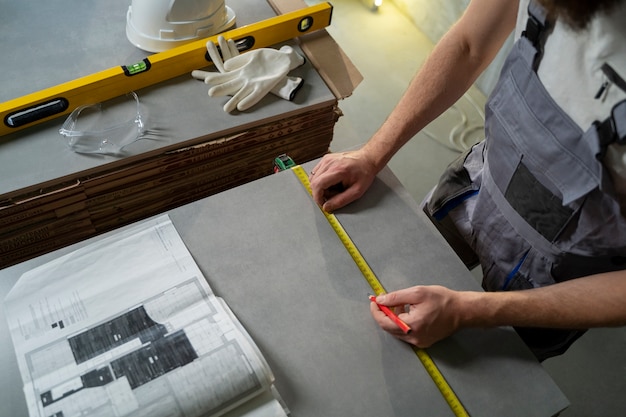 Tiler working on renovation of apartment