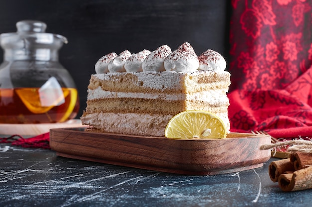 Tiramisu cake on a wooden board. 