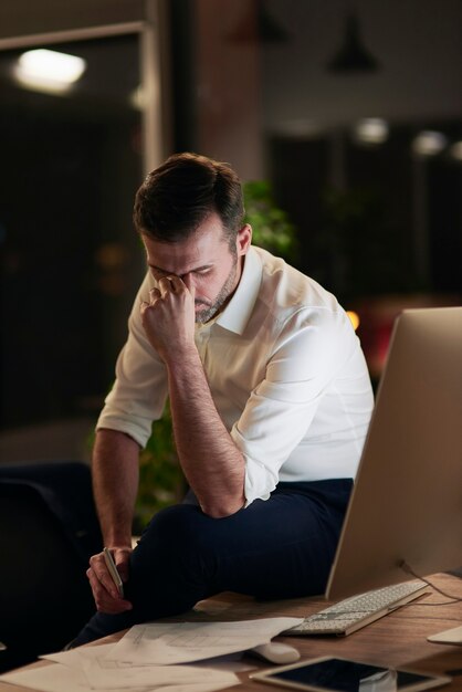 Tired businessman suffering from headache