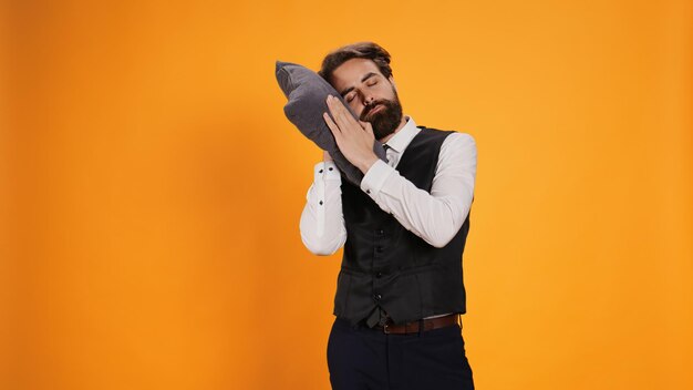 Free photo tired diner employee napping on pillow