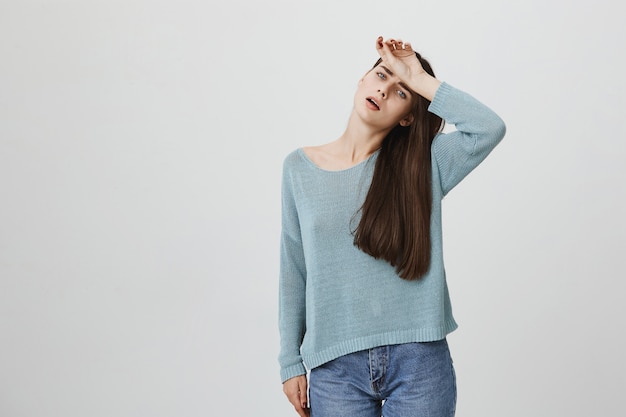 Free photo tired and distressed woman wipe forehead from sweat, exhausted