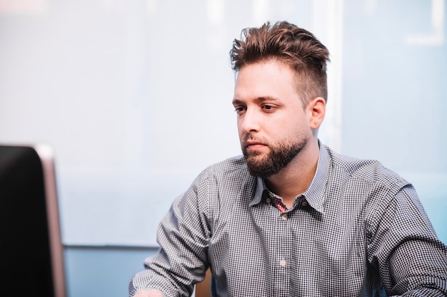 Tired man at computer