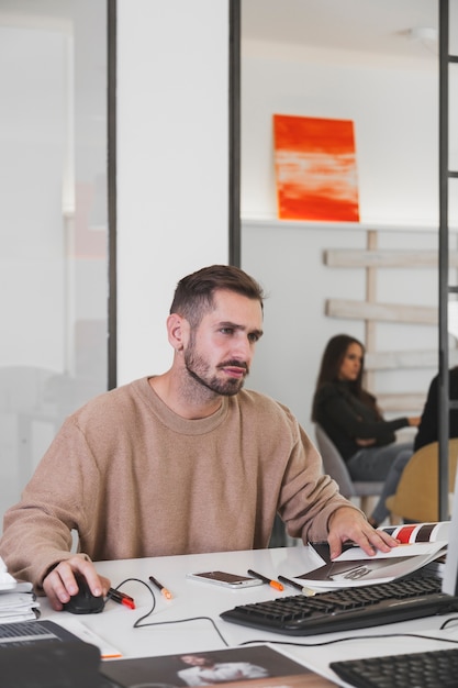 Tired man working in office