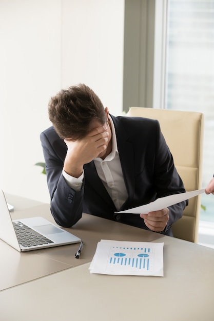 Free photo tired office worker getting more and more work