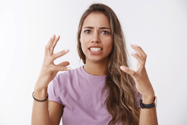 Tired pissed woman raised hands annoyed, furious