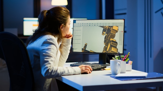 Free Photo tired woman architect working on modern cad program overtime sitting at desk in start-up office. industrial female engineer studying prototype idea on pc showing cad software on device display