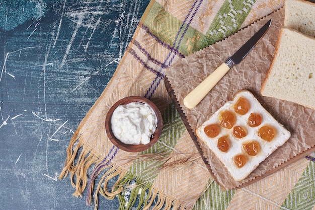 Toast bread slice with yogurt and cherry confiture.