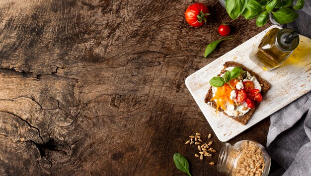 Toast slice with cherry tomatoes copy space