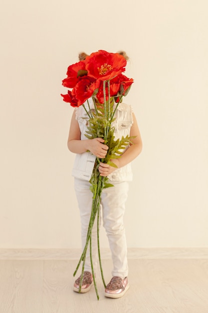 Toddler holding flower bouquet