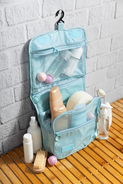 Free photo toilet bag with products arrangement high angle