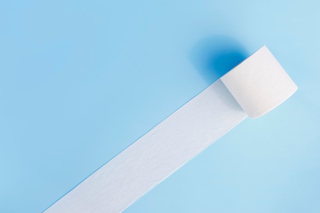 Free Photo toilet paper roll unfolded on desk