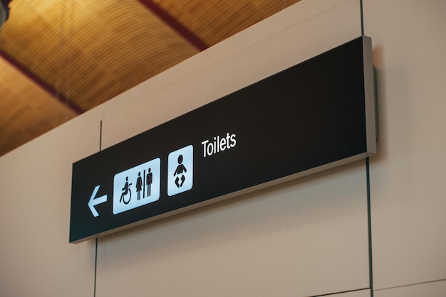 Free photo toilet sign direction at airport