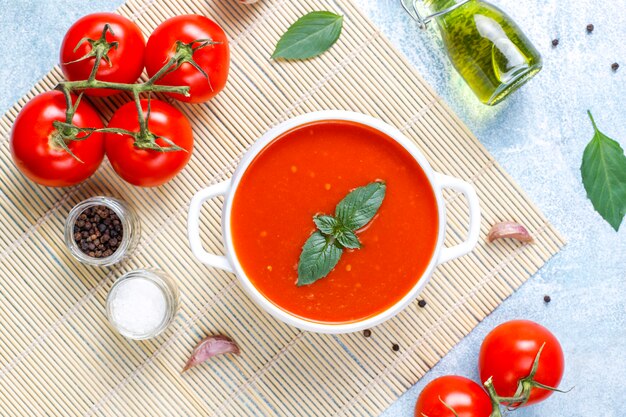 Tomato soup with basil in a bowl.