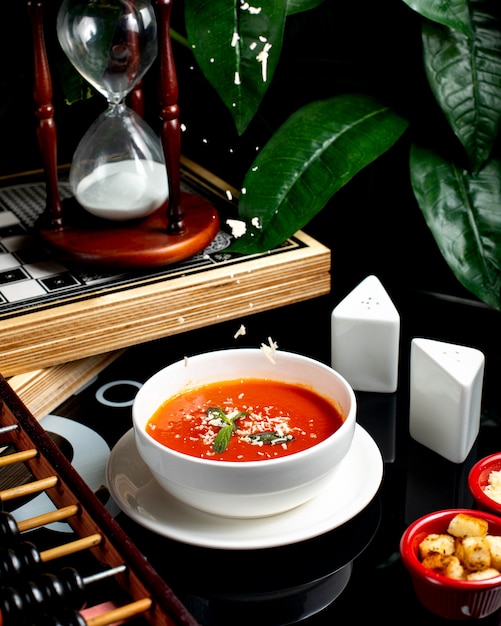 Tomato soup with side crackers and cheese