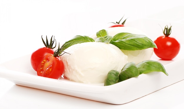 Free photo tomatoes, basil and mozzarella