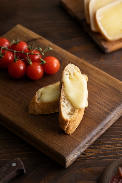 Free Photo tomatoes and bread with cheese high angle