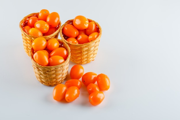 Tomatoes in wicker baskets. high angle view.