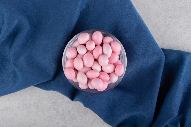 Toothsome gums in the bowl, on the towel, on the marble surface