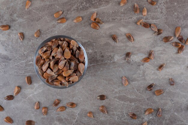 Toothsome seeds in a bowl on the marble surface