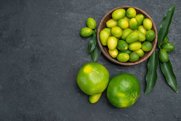 Top close-up view citrus fruits bowl of citrus fruits with leaves mandarins