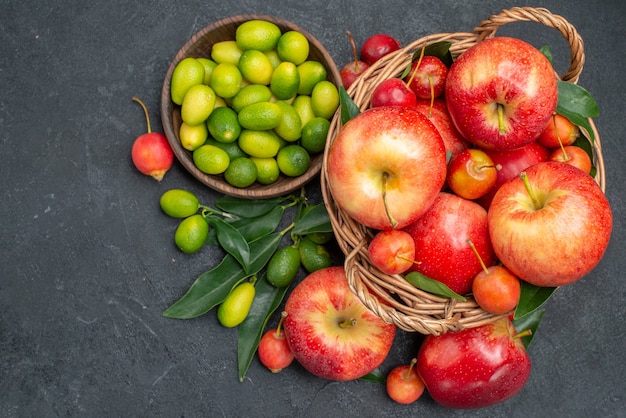 Top close-up view fruits the appetizing pomegranates cherries nectarines apples citrus fruits