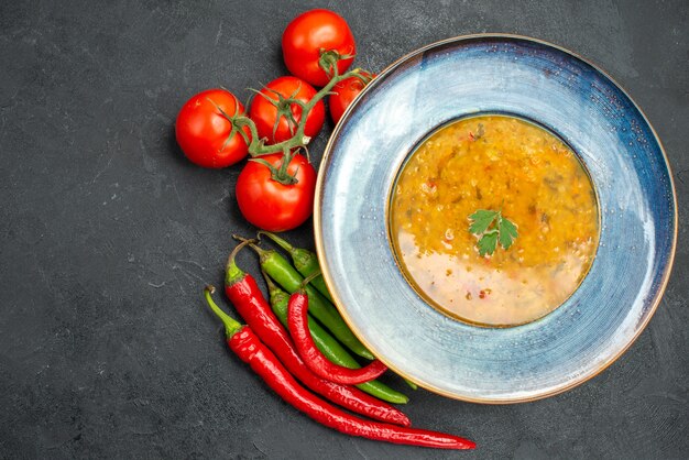 Top close-up view lentil soup lentil soup tomatoes with pedicels hot peppers