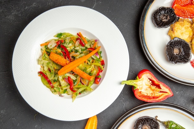 Top close-up view vegetables vegetable salad on the plate