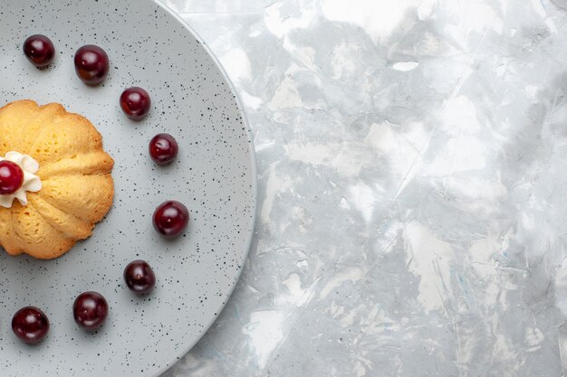 Top close view cake with cherries on grey-light desk, cake biscuit cream fruit photo