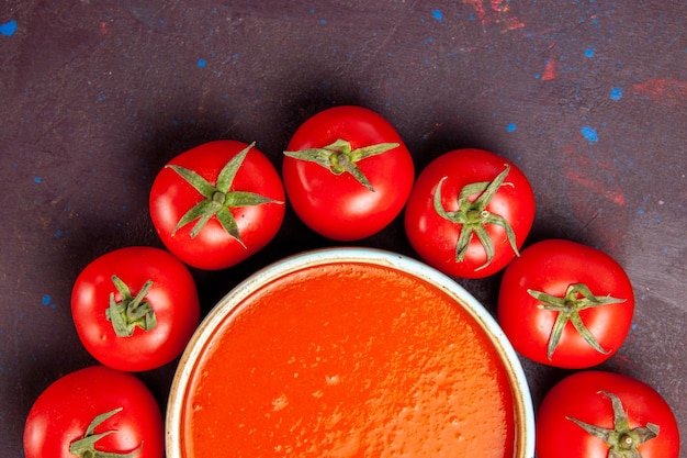 Free Photo top close view delicious tomato soup circled with fresh red tomatoes on the dark space