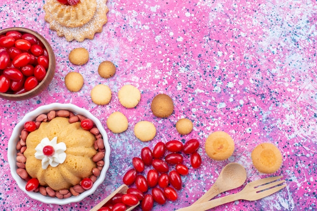 Top closer view yummy simple cake with cream and fresh peanuts red dogwoods on bright light desk, cake biscuit sweet nut berry