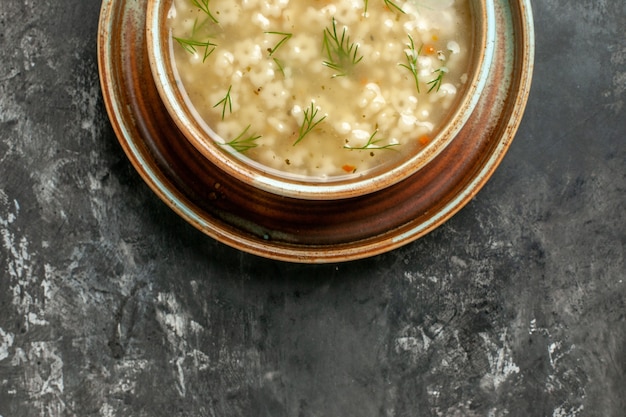 Free Photo top half view star soup in bowl on dark background