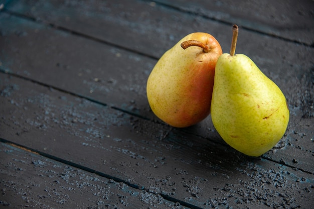 Free Photo top side close-up view two pears ripe green-yellow-red pears on grey table