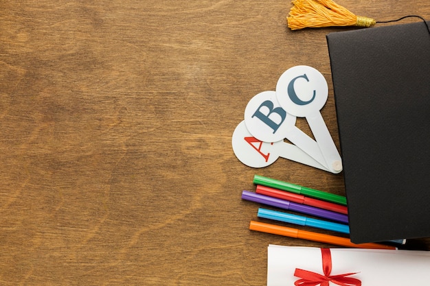 Free Photo top view of academic cap with school supplies and diploma