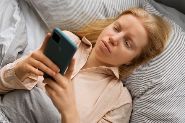 Top view albino woman laying in bed