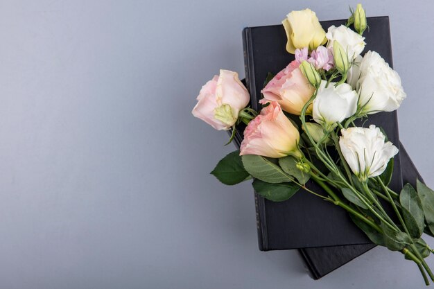 Top view of amazing and colorful flowers like rose daisy on a gray background with copy space