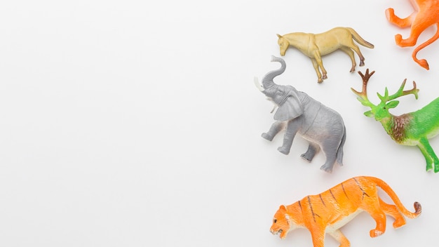 Free photo top view of animal figurines with copy space for animal day