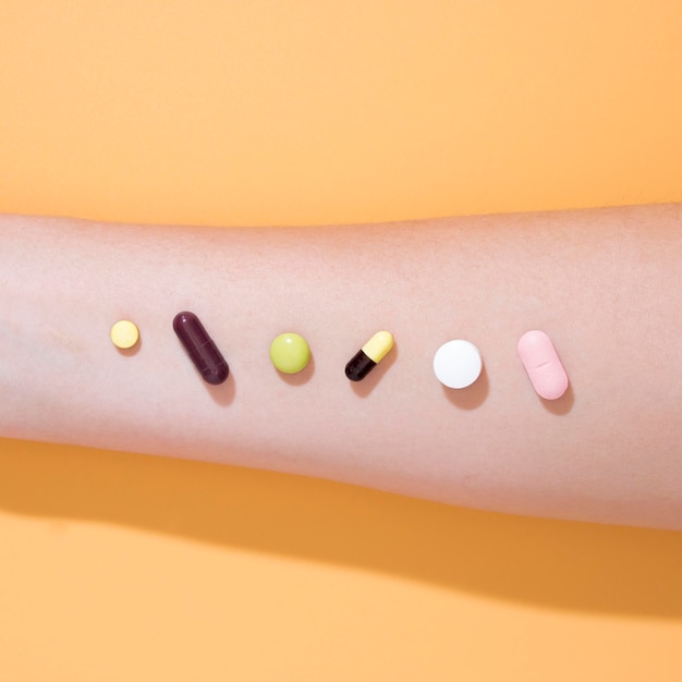 Top view of arm with pills on top