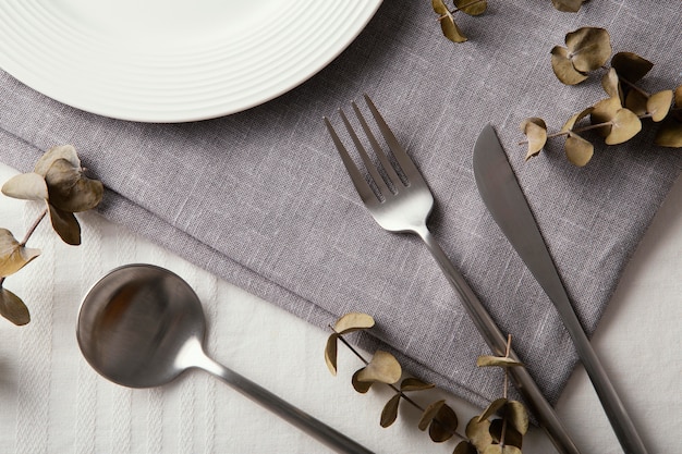 Top view arrangement of beautiful tableware on the table