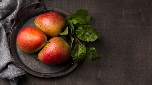 Free Photo top view arrangement of delicious pears with copy space