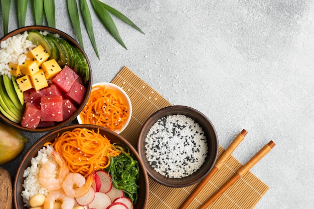 Free photo top view arrangement of delicious poke bowl