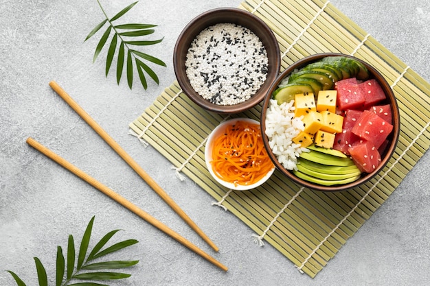 Top view arrangement of delicious poke bowl