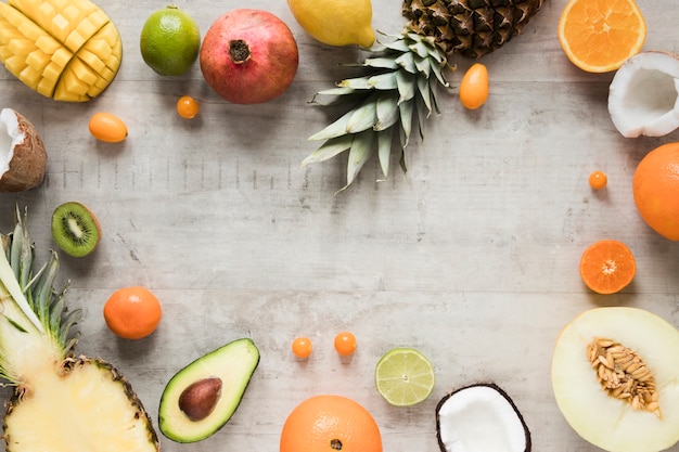 Top view arrangement of exotic fruits on the table