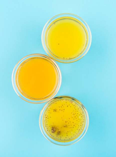 Top view arrangement of glasses with citrus juice