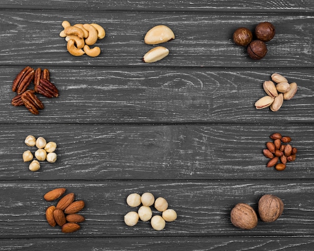 Free Photo top view arrangement of organic nuts copy space