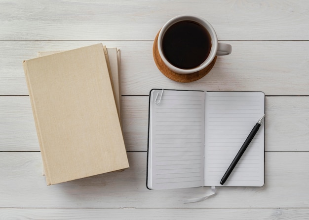 Top view arrangement with books and cup