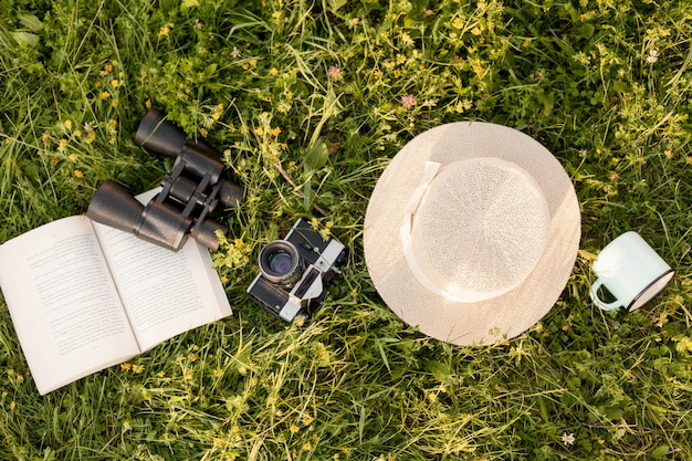 Free photo top view arrangement with camera on grass