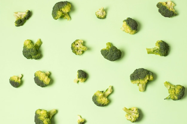 Top view arrangement with cauliflower on green background