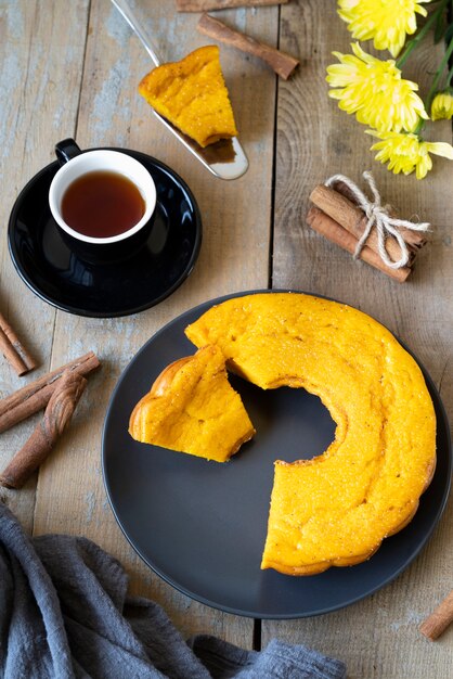 Top view arrangement with cup of tea and delicious pie