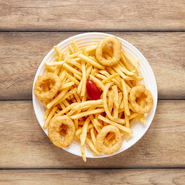 Top view arrangement with fries and onion rings