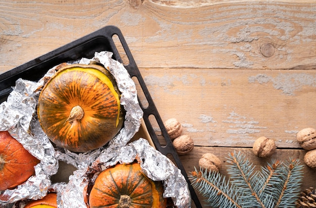 Top view arrangement with pumpkins and wooden background